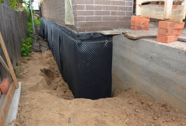 SJ Waterproofing Pros technician performing targeted Basement Waterproofing assessment in Maumee, OH